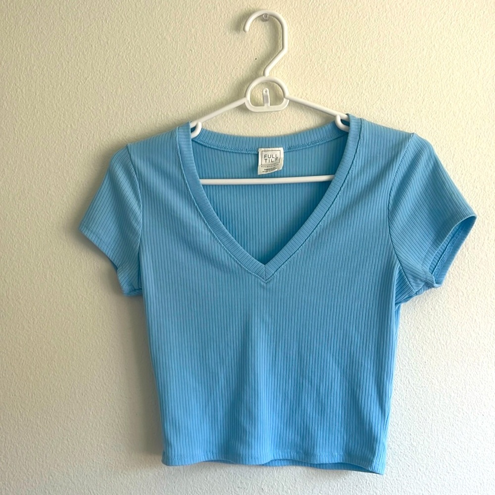Light blue V neck cropped top.